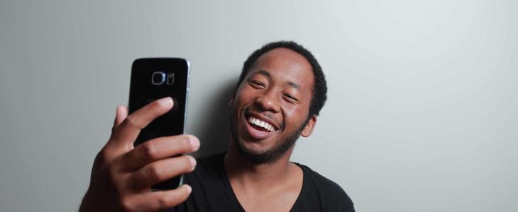 Man taking a new driver's license photo