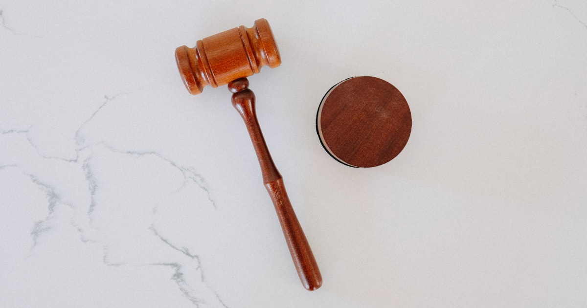 Wooden gavel on marble surface