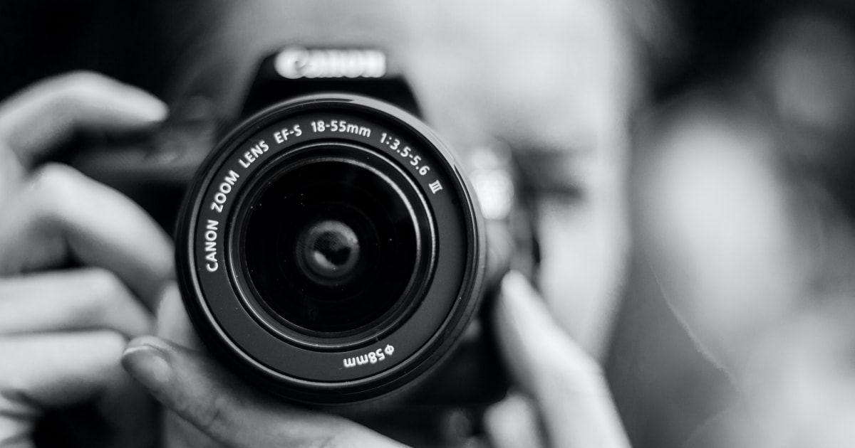 Black and white photo of Canon camera lens