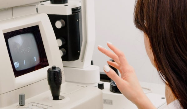Ophthalmologist working with medical machine
